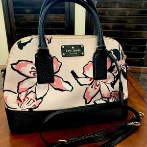 Kate Spade canvas and leather floral satchel with crossbody strap.